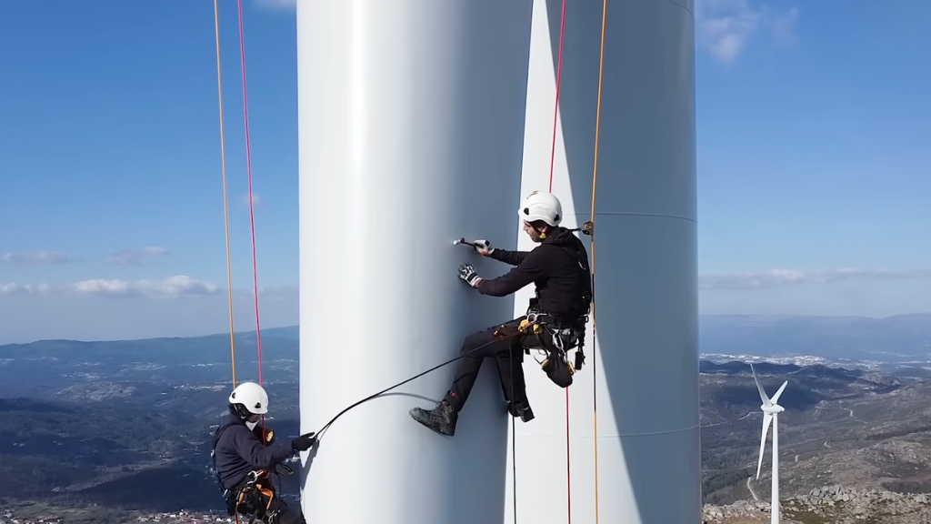 Two Wind Turbine Technicians Are Rappelling Down the Tower 