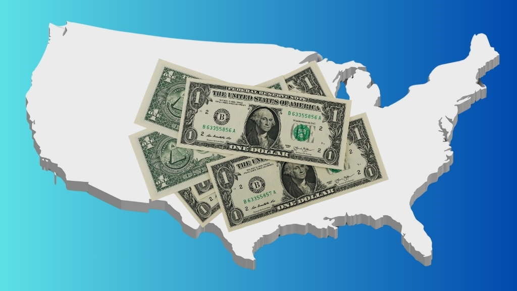 A Stack of One-Dollar Bills Placed Over the Outline of The United States, Representing the Concept of The Lowest Cost of Living in 2025