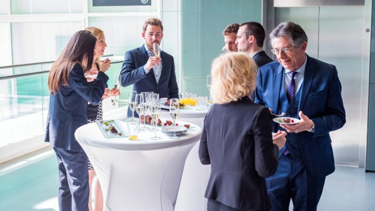 People networking at a business gathering during local events
