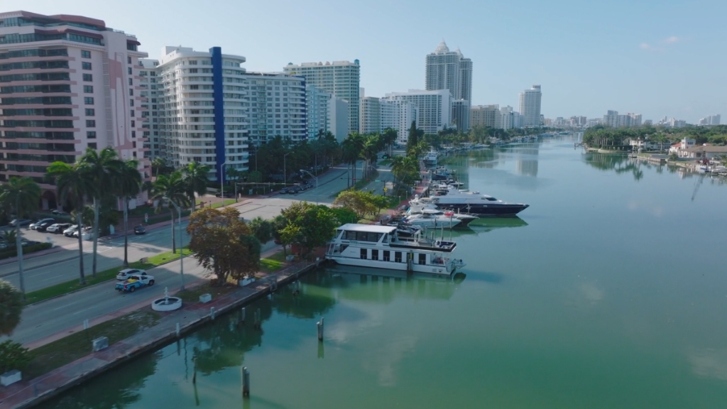 High-rise condos and waterfront boats along a canal in Miami, Florida