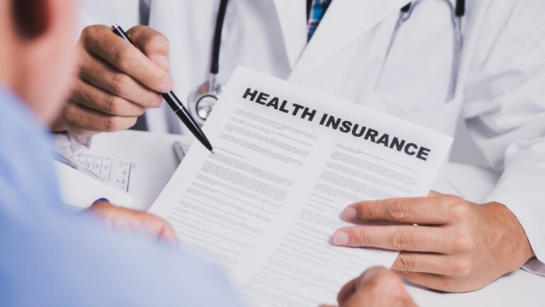 Doctor explaining policy details about the most affordable health insurance in 2025
