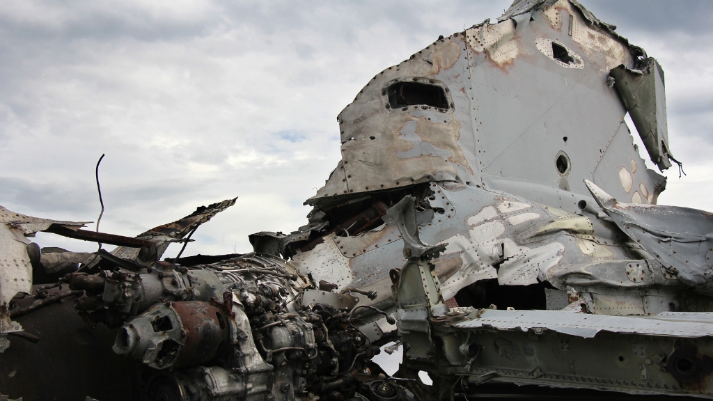 Close-up of a destroyed airplane fuselage and engine wreckage
