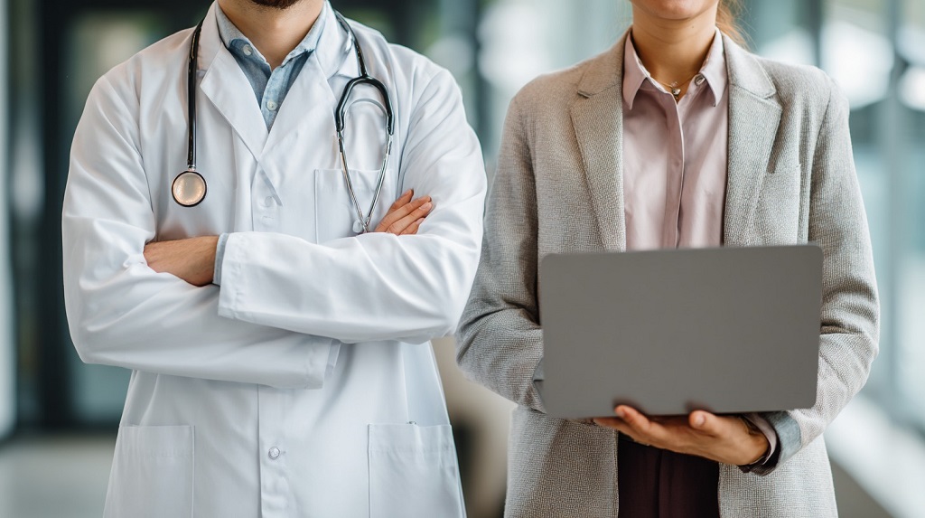 A medical doctor standing beside a researcher holding a laptop, symbolizing two paths of expertise