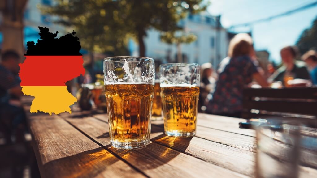 Beer glasses on a wooden table at a German outdoor beer garden