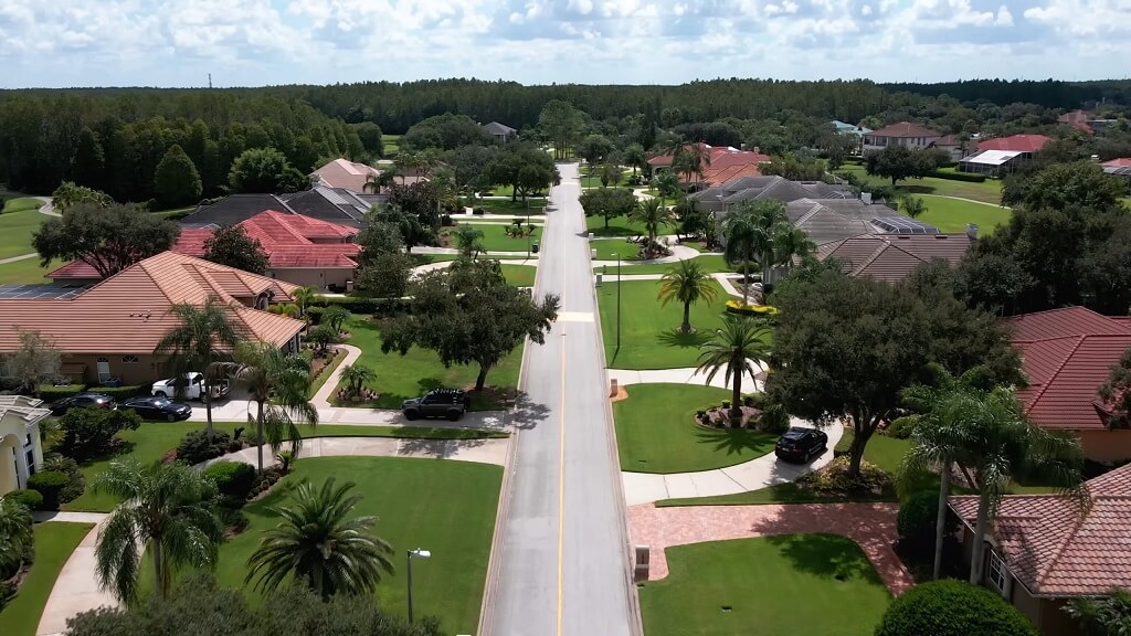 Suburban Tampa neighborhood with wide streets, palm trees, and large single-family homes with landscaped yards