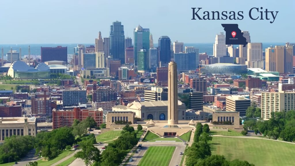 Aerial view of Kansas City skyline with the Liberty Memorial in the foreground and downtown buildings behind