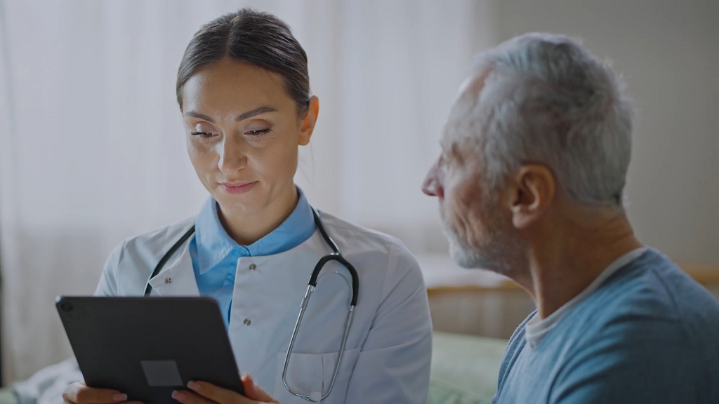 Patient discussing health insurance plan options with a doctor