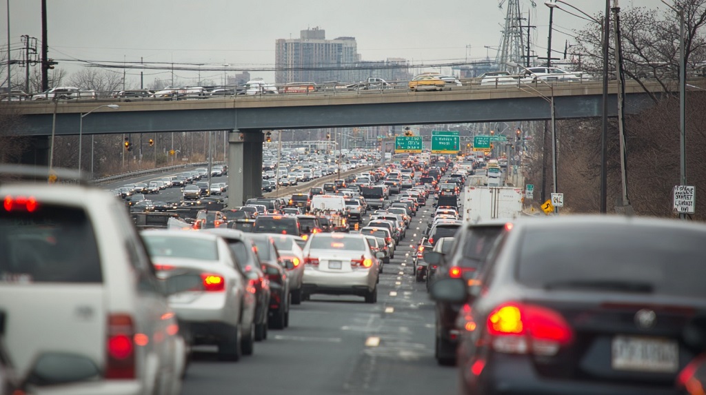 Heavy traffic congestion on a New Jersey highway illustrates how constant urban pressure and stop-and-go driving contribute to aggressive driving behavior