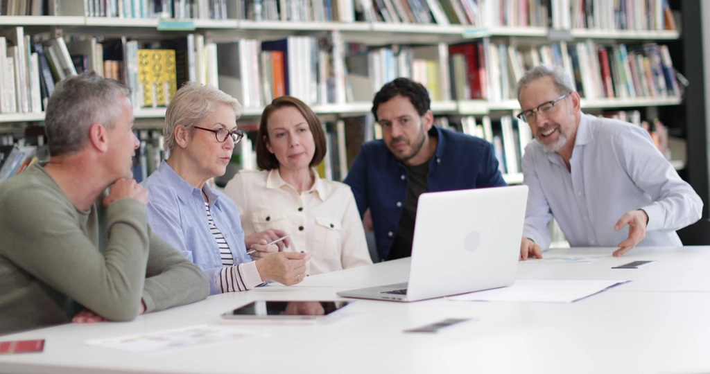 Healthcare and policy professionals reviewing information together during a public health discussion