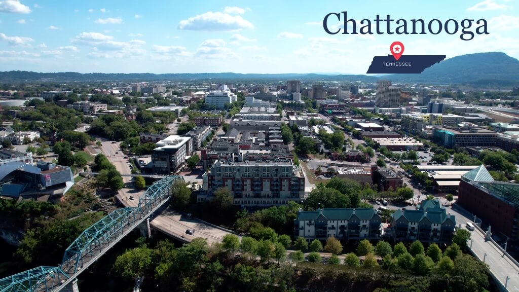 Aerial view of Chattanooga showing the downtown area, river crossings, and surrounding hills