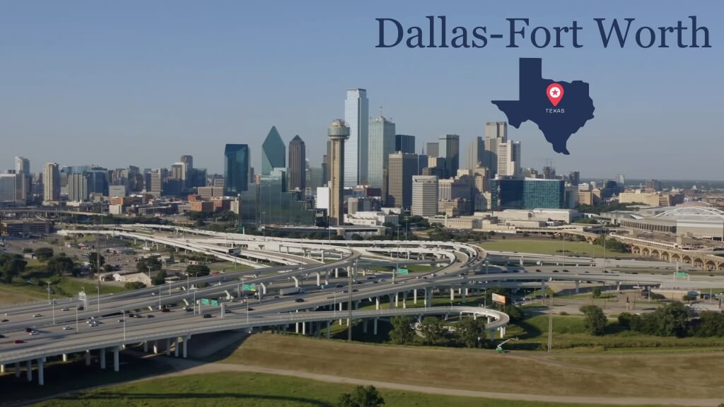 Aerial view of the Dallas–Fort Worth skyline with highway interchanges and modern high-rise buildings