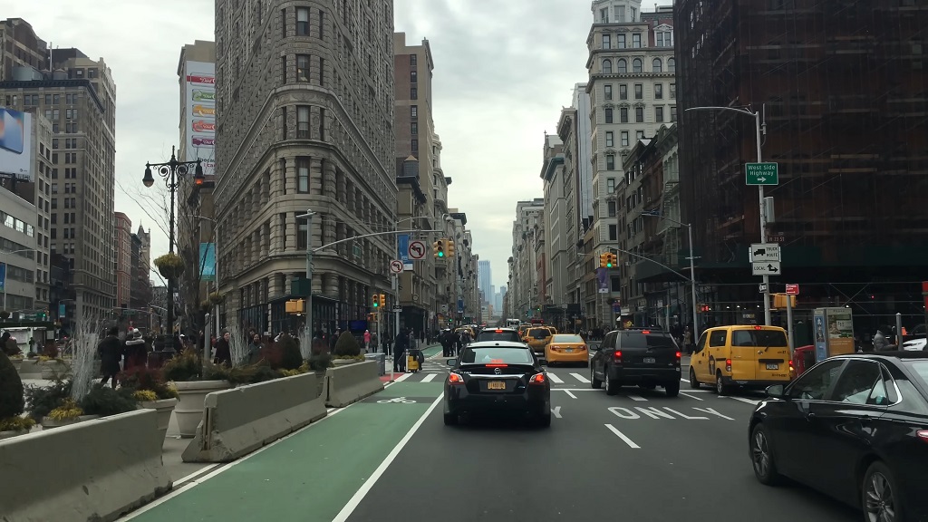 Busy urban U.S. city street with heavy traffic and mixed road users, illustrating complex conditions and ongoing safety challenges