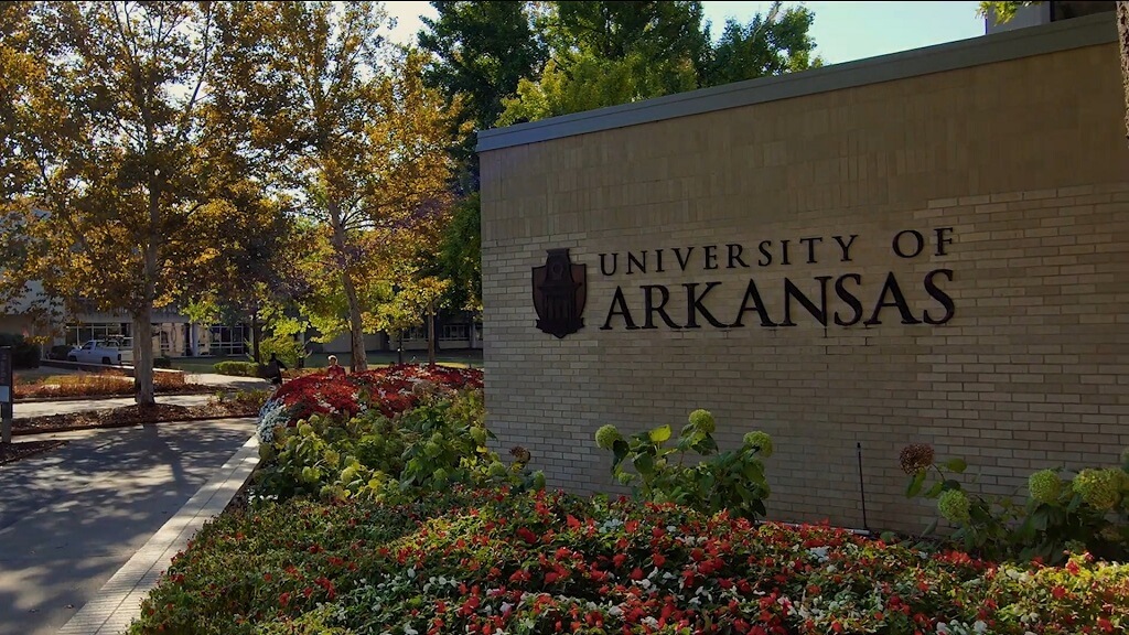 University of Arkansas campus entrance sign with landscaping