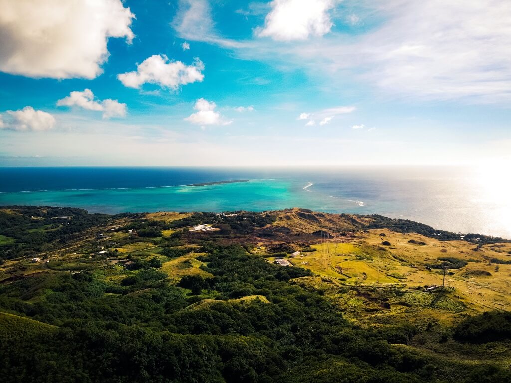 An aerial view of a stunning beach sunset in Guam